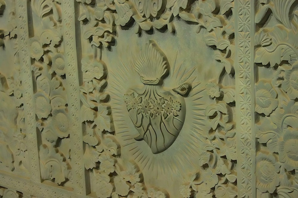 The heart pierced by a sword symbolizes Mary's sorrow, especially during the crucifixion of Jesus